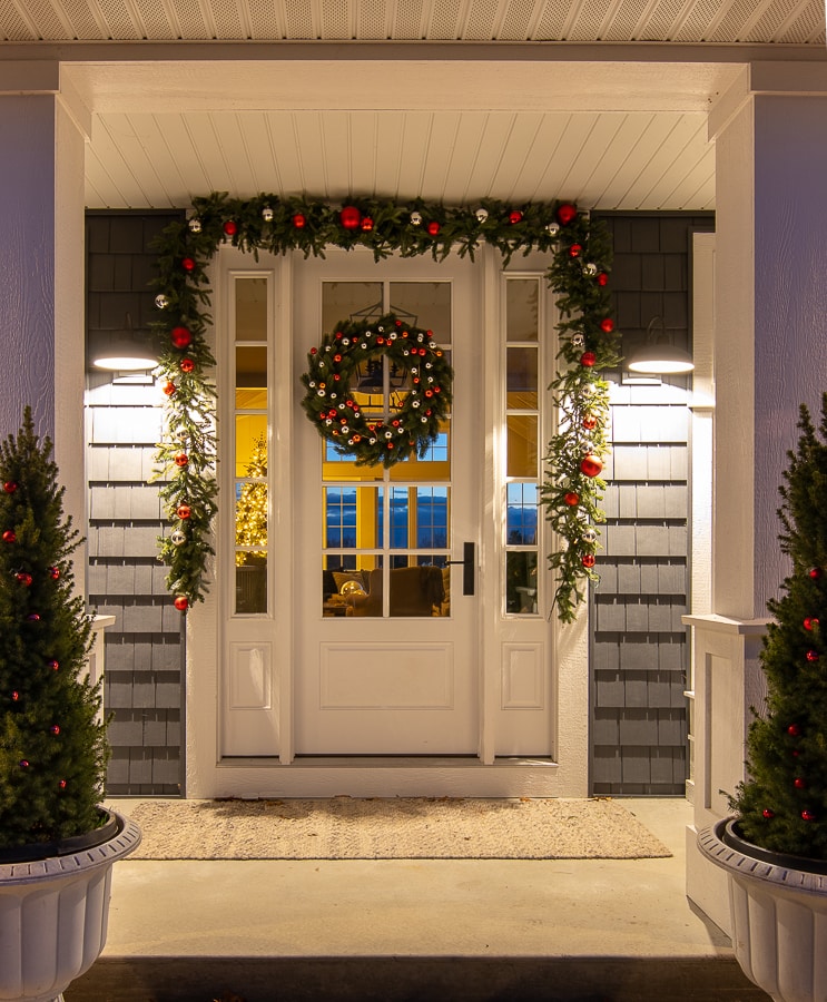A front door with a Christmas wreath