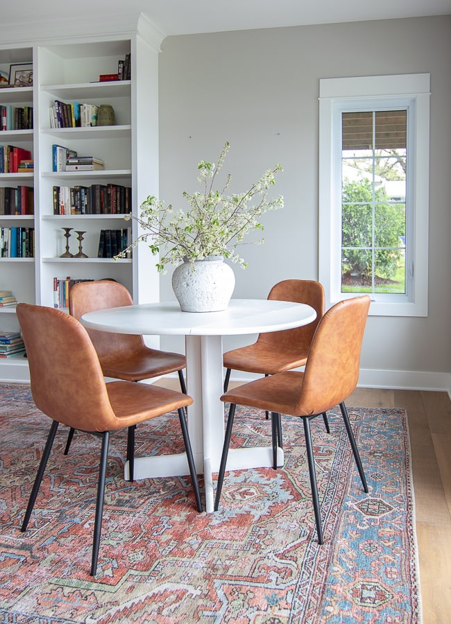 white dining table leather chairs