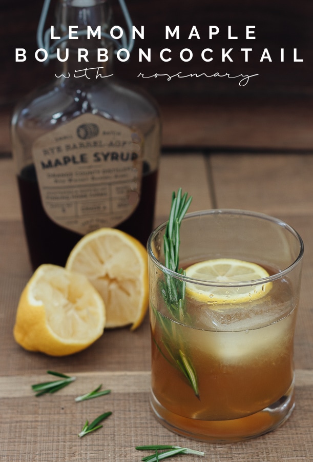 glass of bourbon and bottle of maple syrup with rosemary sprigs and lemon slices with text overlay 